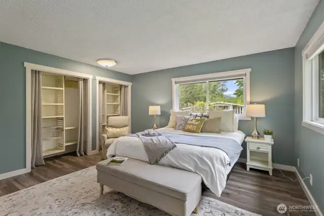 Spacious primary suite with custom closet system.