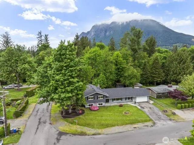 Quietly situated on a spacious corner lot in a serene neighborhood setting.