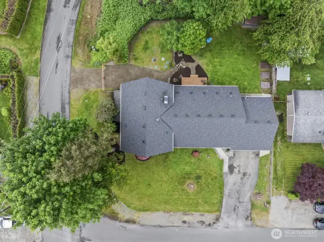Expansive aerial view showcases the nearly 1/2 acre level lot with multiple versatile yard spaces.
