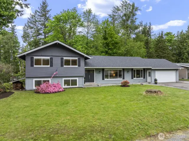 Freshly painted exterior and updated landscaping deliver standout curb appeal    .