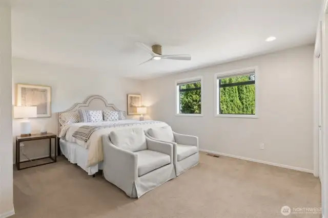 Step into your spacious main floor primary suite—where comfort meets elegance, complete w/ serene views & a relaxing atmosphere that feels like your own private escape
