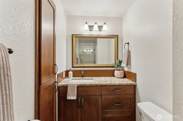 Main floor bath combines convenience & style—easily accessible for guests or everyday use, with thoughtful finishes that complement the home’s overall design