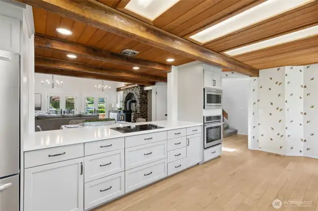 Expansive counters & rich cabinetry offer style & storage—w/ open sightlines into the great room, creating a perfect hub for connection, conversation & comfort