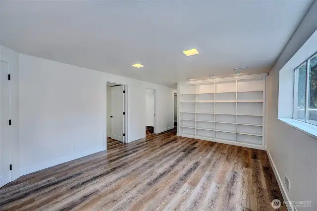 Another angle of the rec room with built-in shelving