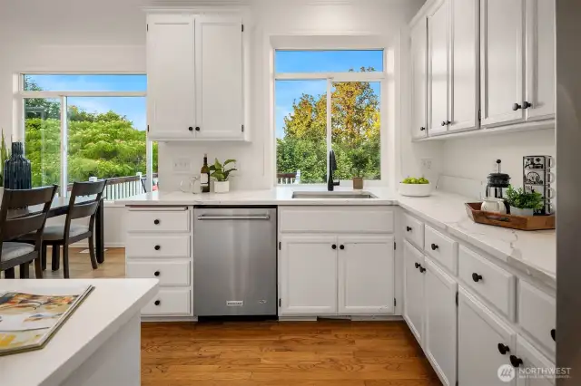 The chef’s kitchen is very spacious and features newer stainless appliances and new quartz countertops.