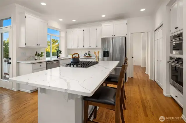 The bifold doors to the right of the frame lead to a large pantry. The pocket door leads to the dining room.