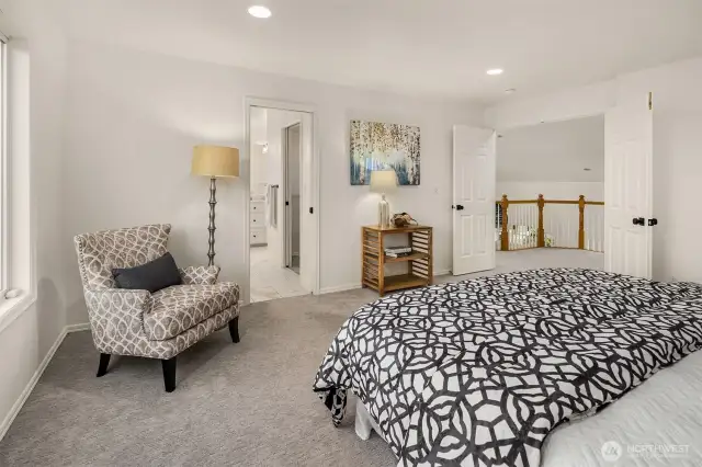 Double doors lead to primary suite on the upper level.