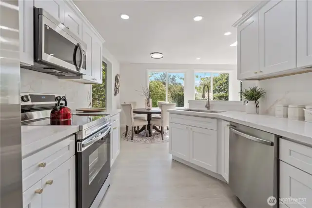 Modern, stylish kitchen featuring all-new stainless steel appliances