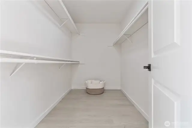 Generous walk-in closet provides ample storage and organization in primary suite