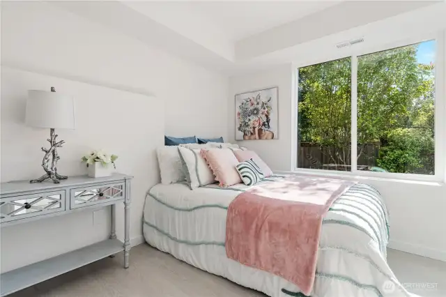 Bright lower-level bedroom with natural light