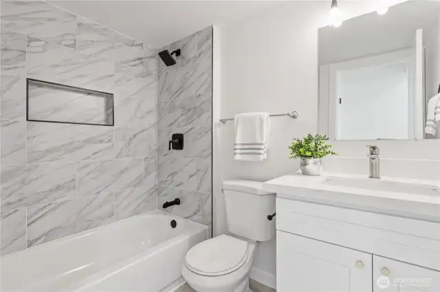 onvenient full bathroom on the lower level with modern finishes