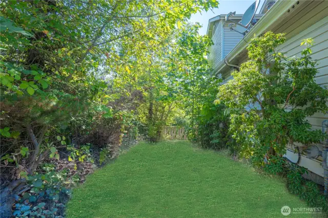 Private fenced yard with separation from the street