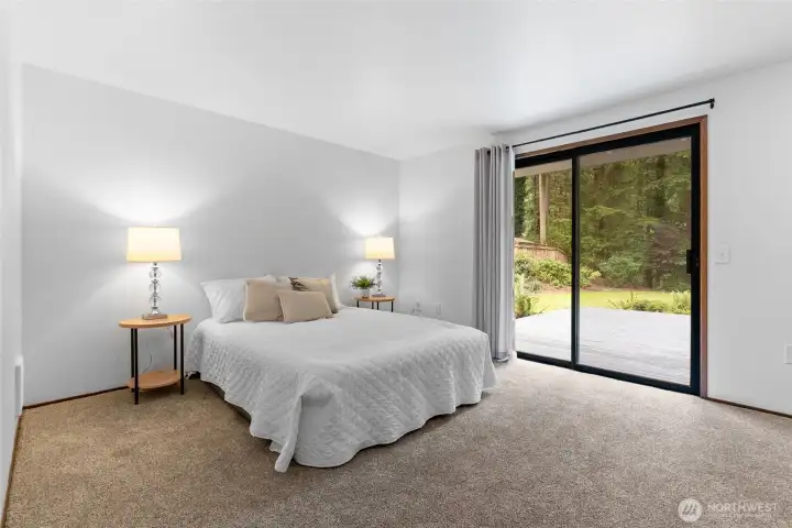Primary bedroom with backyard view