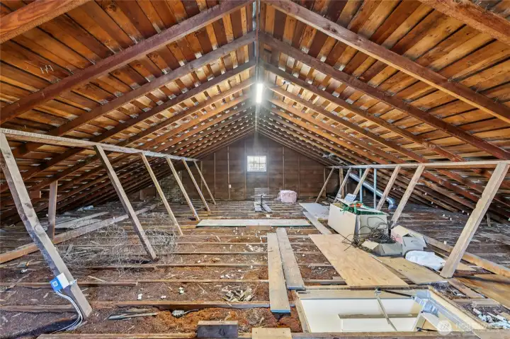 Great attic space.  Potential to add dormers and finish space? Insulation in the attic is probably shredded cedar bark, famously impervious to fire