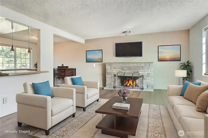 Spacious living room that is open to kitchen and dining area including a pricture window with peakaboo view. Room is virtually staged, does not reflect owners personal items.