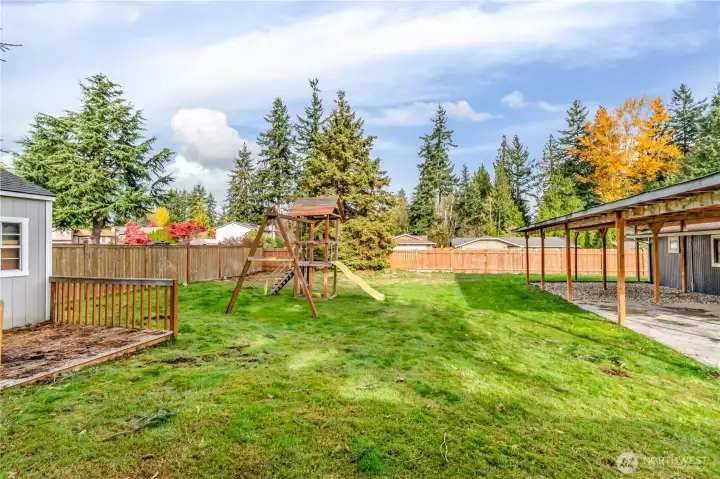 Fenced back yard has so much room for gardening