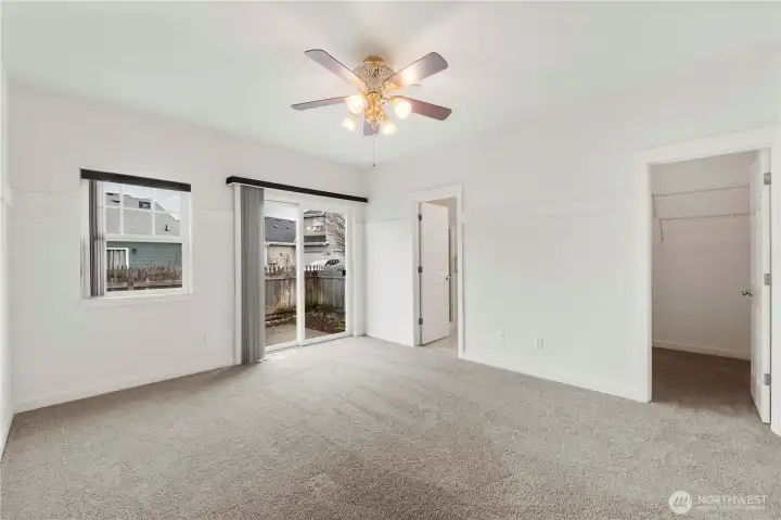 Primary bedroom has private access to courtyard fenced patio