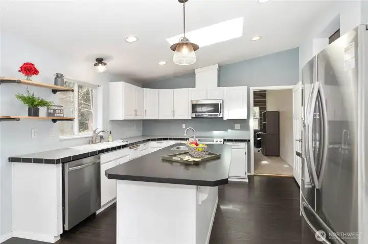 Kitchen looking into bonus room