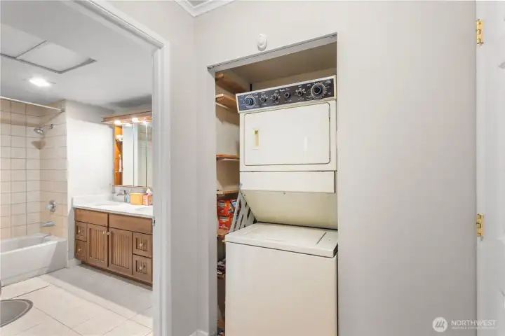 Laundry tucked away conveniently between bathroom and bedrooms.