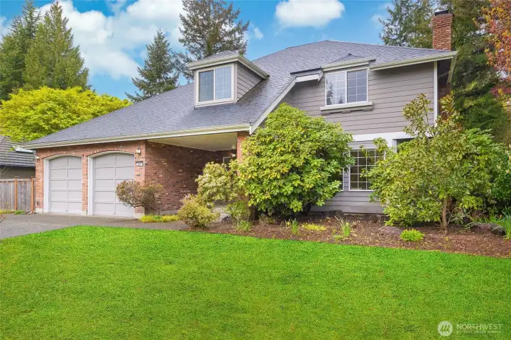 Front of home with large lawn.