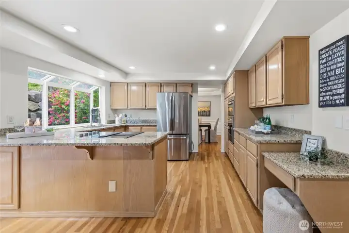 Chef's kitchen with desk area.