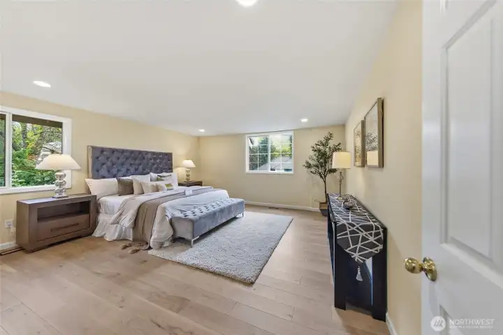 Spacious primary bedroom on upper level.