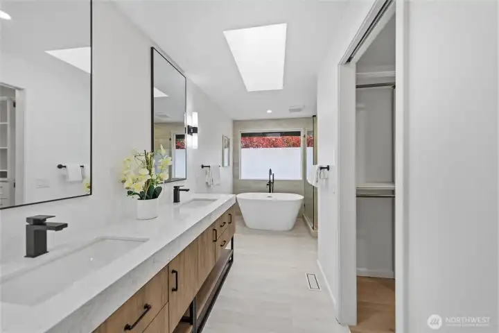 Beautifully remodeled primary bath with skylight.