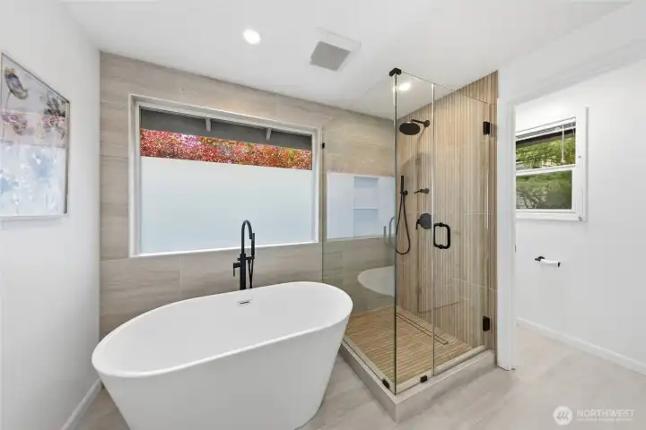 Tub and shower in primary bath.