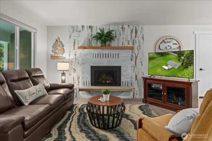 Filled with natural light, the living room offers a warm and inviting atmosphere.