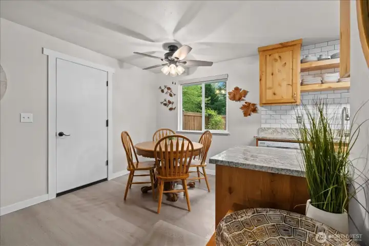 The open and inviting dining room creates the perfect setting for everyday meals and special gatherings. Bright and welcoming, the dining room offers an open space designed for connection and comfort.