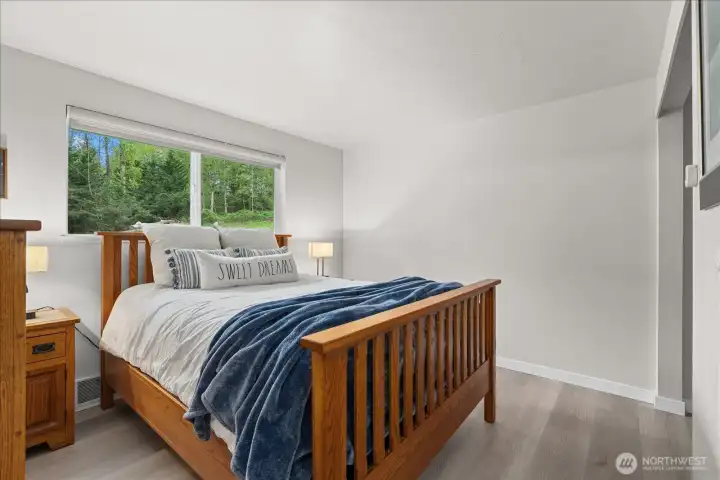 Peaceful and comfortable, the primary bedroom offers a relaxing retreat. Natural light gives the primary bedroom a bright and airy feel.