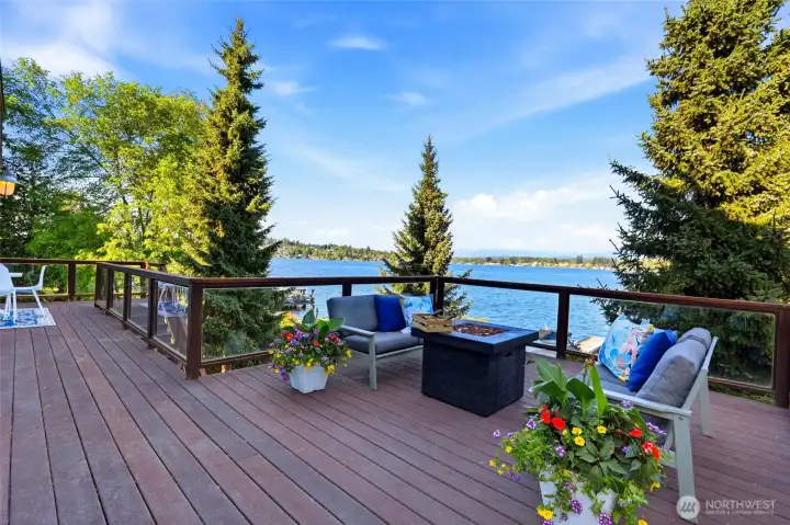 Expansive deck off the living room for relaxing and soaking in the Mountain and Lake views.