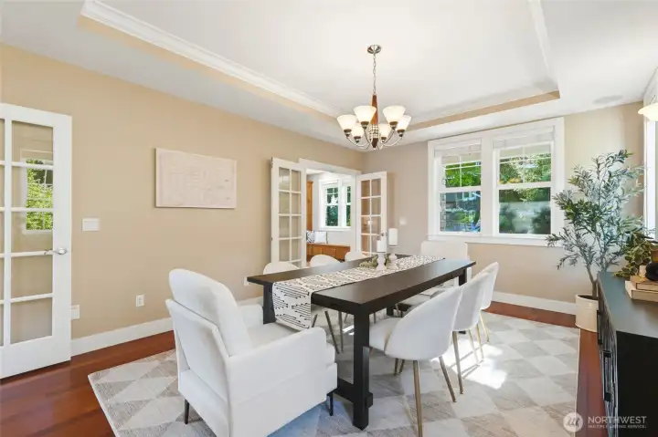 Dining room is big enough for all your dinner parties and features french doors from the main living room and from the kitchen.