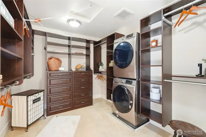 Primary walk-in closet with it's owner washer/dryer!