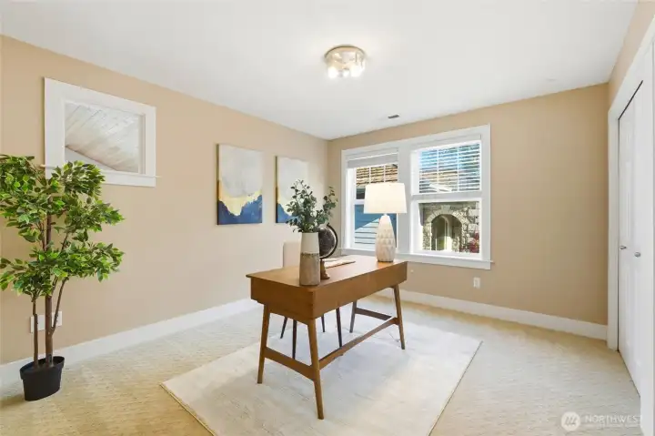 Second bedroom upstairs, staged as an office.