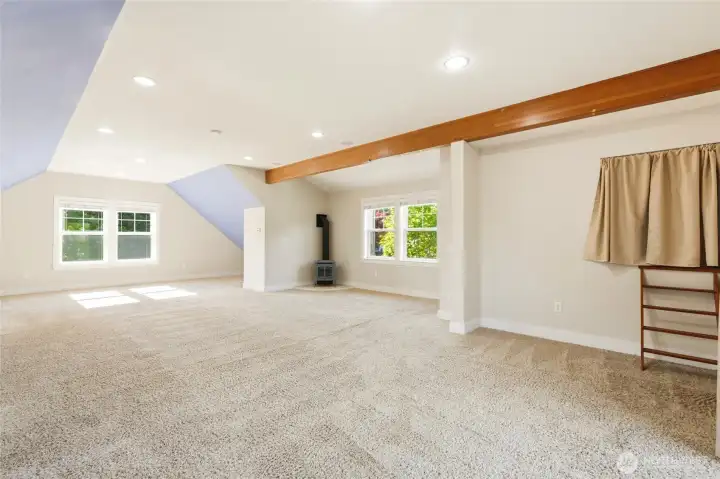 Garage apartment has a gas fireplace, kitchen, washer/dryer & a view balcony.