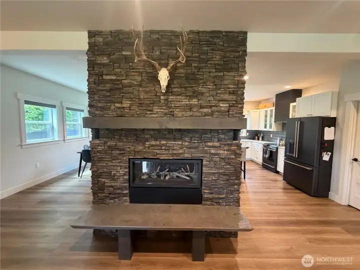 Fireplace, double sided for viewing from the living room and kitchen Fireplace, double sided for viewing from the living room and kitchen