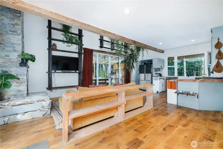 Cathedral ceilings and an open floor plan create a sense of space while maintaining the home's warm, inviting character.