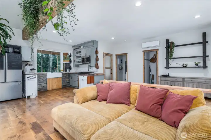 Light-filled and inviting, the open-concept living space brings the kitchen and great room together beneath soaring cathedral ceilings, creating a home that feels both spacious and welcoming.