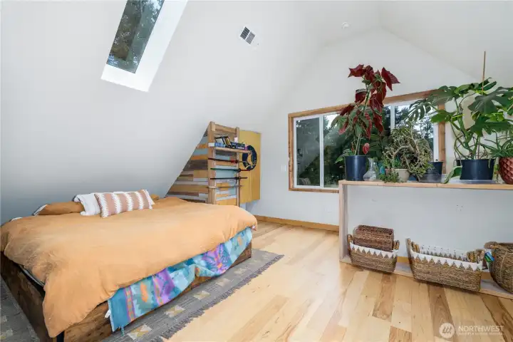 End each day beneath the stars as moonlight filters through the skylights into this inviting loft retreat.