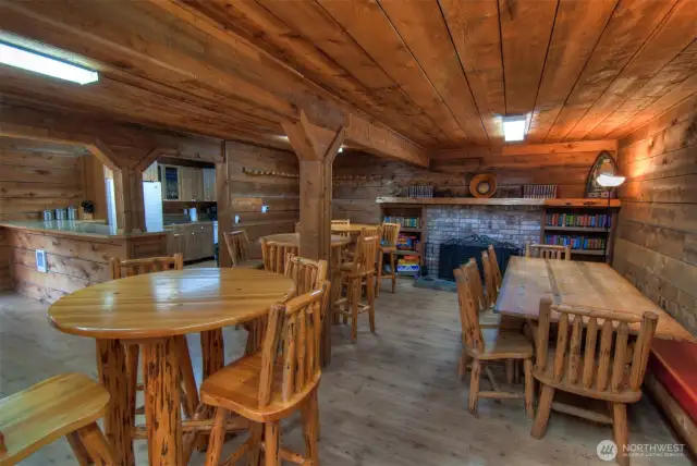 Inside with clubhouse with full kitchen, table and chairs