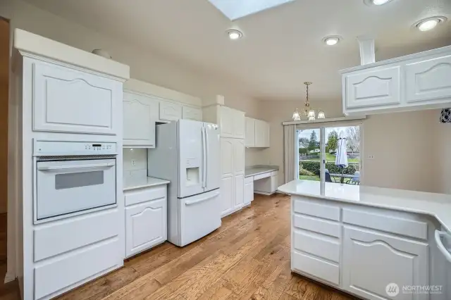 Abundant cabinets are available for all of your storing needs, along with an added desk area.