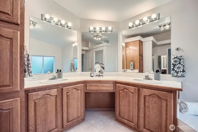 Primary bath offering dual sinks and space for a chair to make getting ready a breeze.