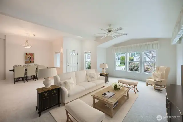 The large living area, which is adjacent to the dining room, offers endless entertaining options.   *virtually staged