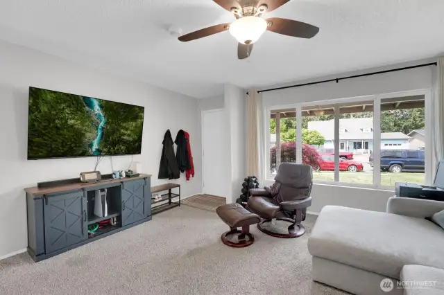 Living Room features large window. All windows have been updated to vinyl.