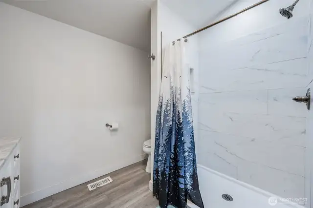 Walk in shower on main.