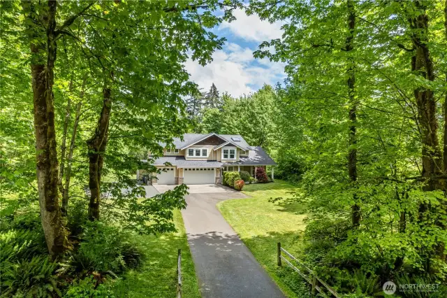 Tree lined entry opens to 1.52 acres of private bliss.  The outlook from house will never change as the properties across the street are owned by lake front houses and reserved for septic drainfields.