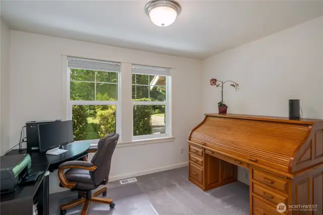 Downstairs office has view of front yard.
