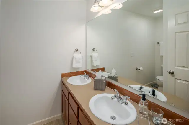 Secondary bathroom.  Large Vanity and double sinks.