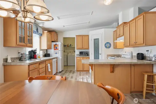 Open & bright space- lovely cabinetry - walk in pantry- fridge included.